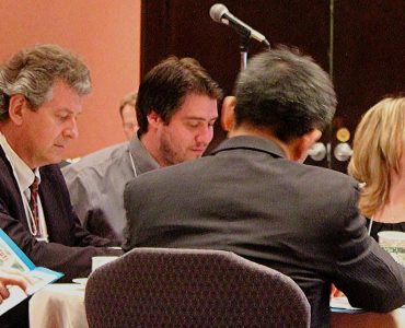 Delegates prepare for the day.